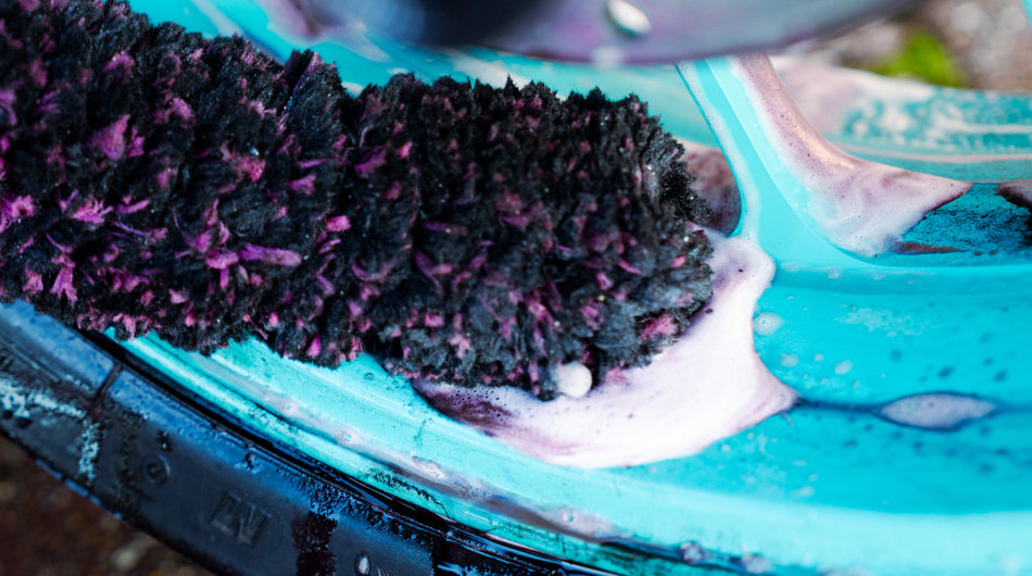 Wheel Cleaner agitated on a wheel using a brush
