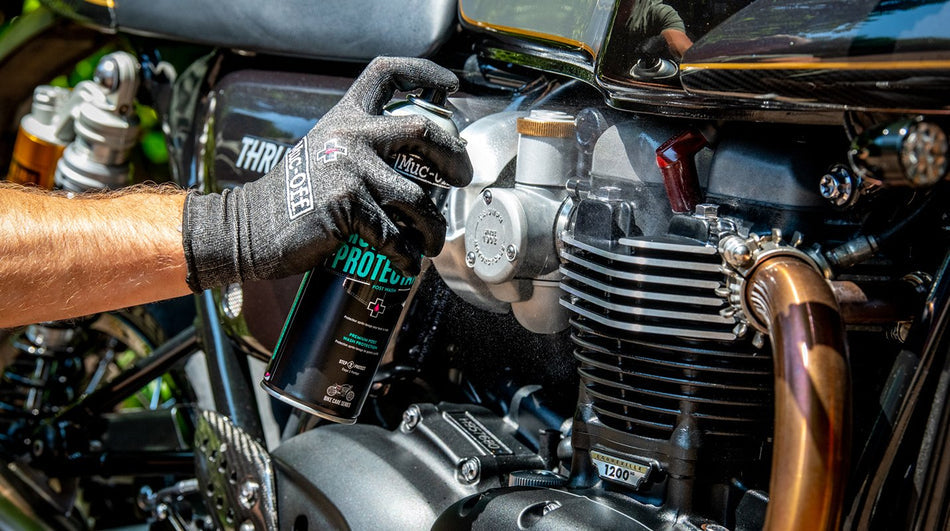 Muc-Off Motorcycle Protectant applied around a motorcycle engine