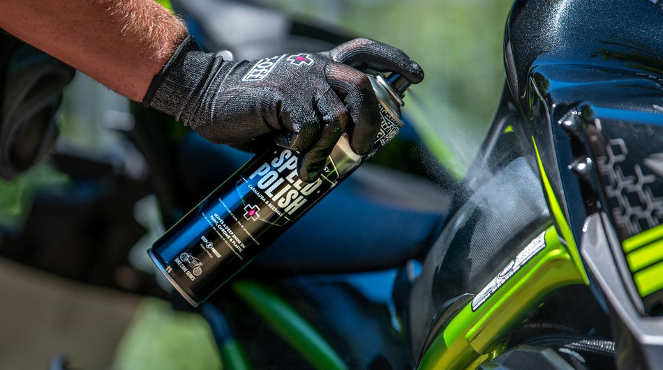 Muc-Off Speed Polish applied to a motorcycle fuel tank