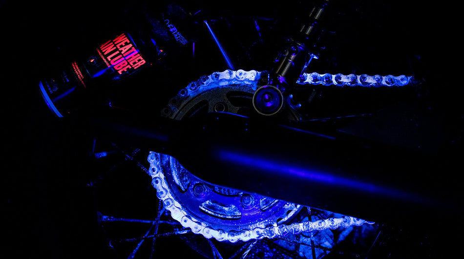 Muc-Off All-Weather Chain Lube coverage visible under inspection lighting