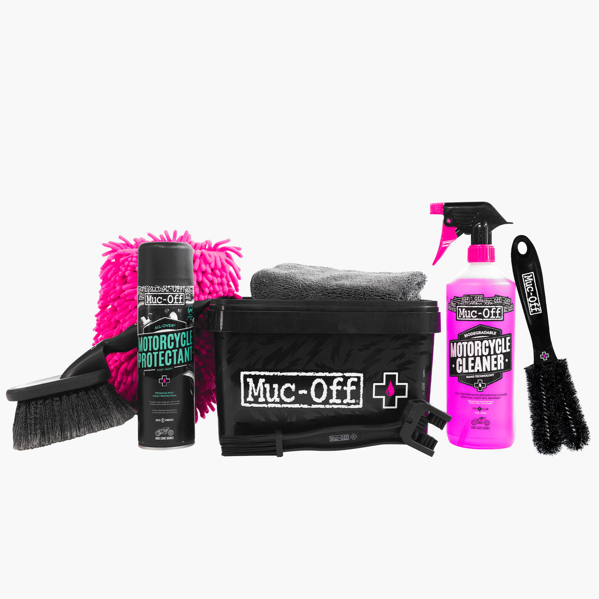 Muc-Off Motorcycle 8 in 1 Kit unpacked with cleaning products, brushes, wash mitt, cloth and storage tub