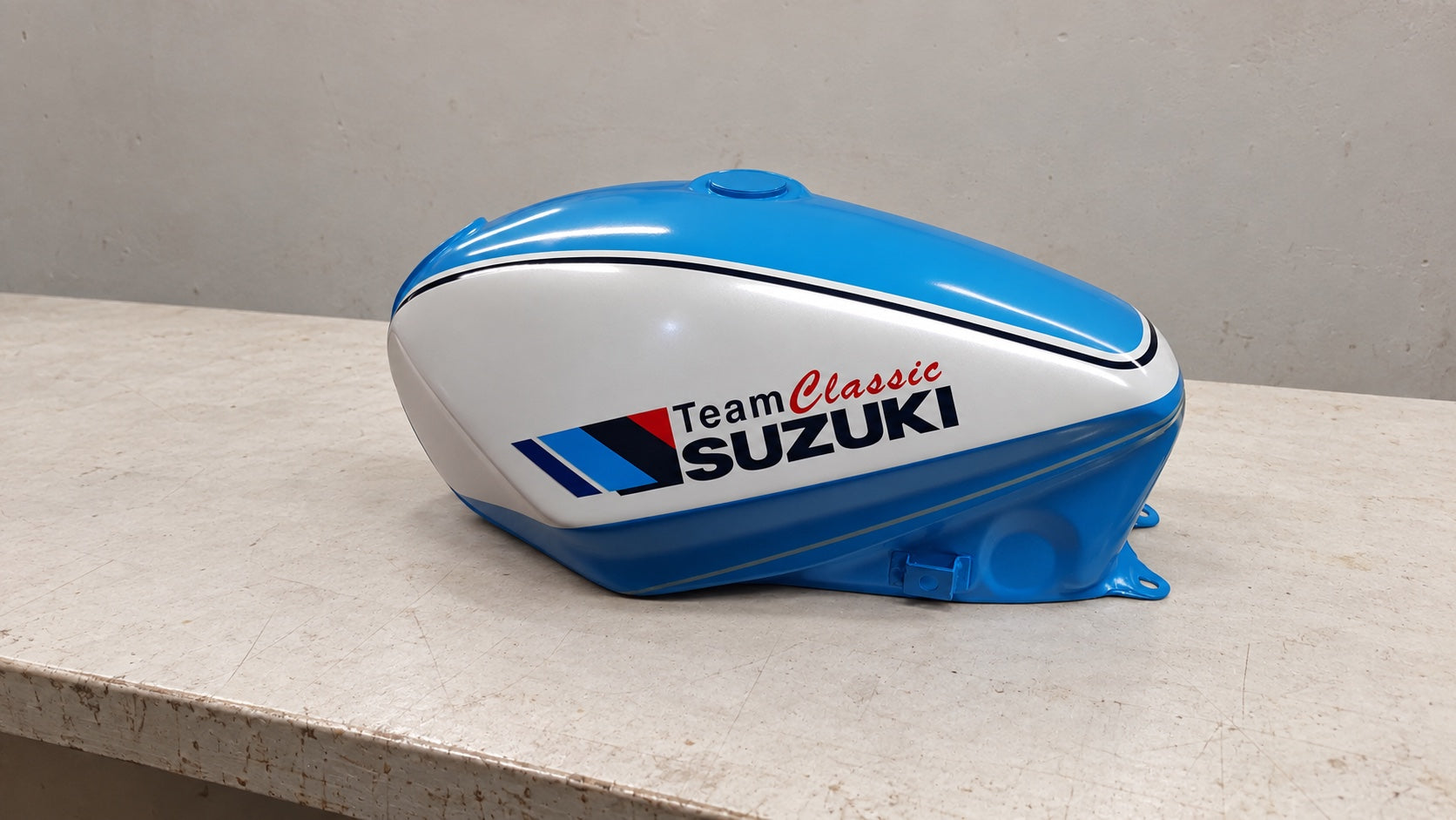 Blue and silver Team Classic Suzuki fuel tank with crisp graphics and lining
