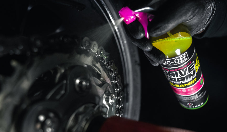 Muc-Off Powersports Drivetrain Cleaner 500ml sprayed onto motorcycle chain components