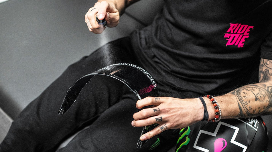 Spray application to a motorcycle helmet visor