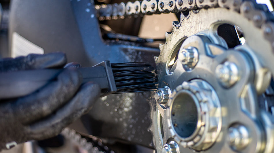 Muc-Off Motorcycle Chain Brush used on a rear sprocket
