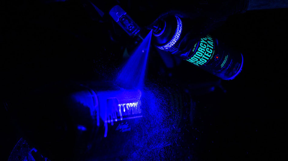 Muc-Off Motorcycle Protectant application under blue inspection lighting