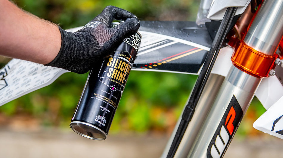 Muc-Off Silicon Shine applied around a motorcycle fork