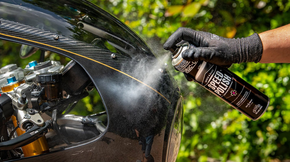 Muc-Off Speed Polish sprayed onto motorcycle bodywork