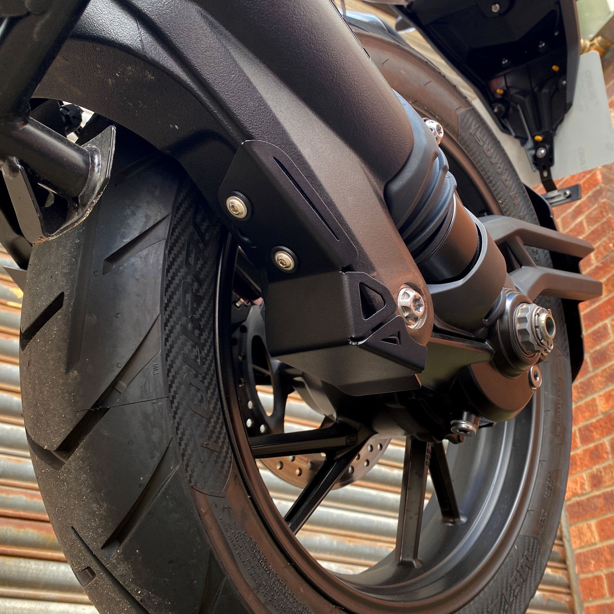 Pyramid Swingarm Protectors | Matte Black | Triumph Tiger 1200 Rally Pro 2022>Current -  Shop name