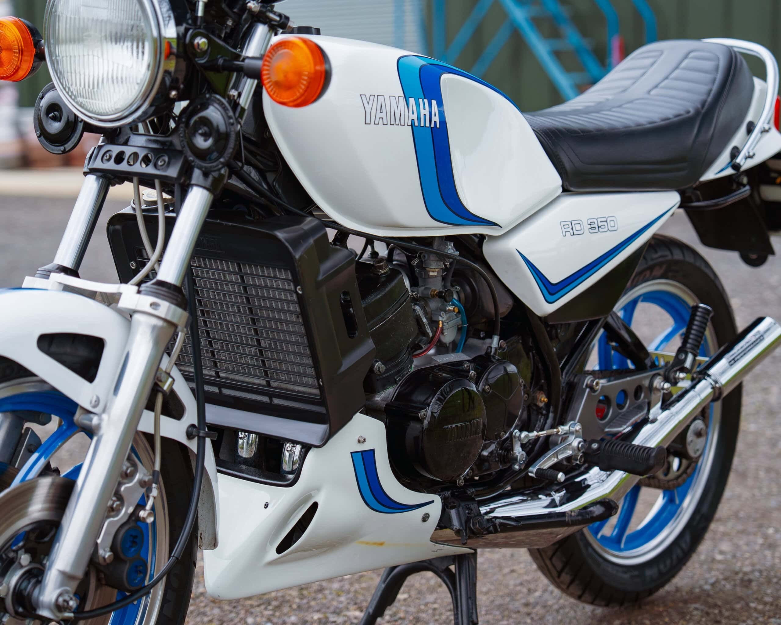 White Yamaha RD350 showing blue period decals on the tank and bodywork