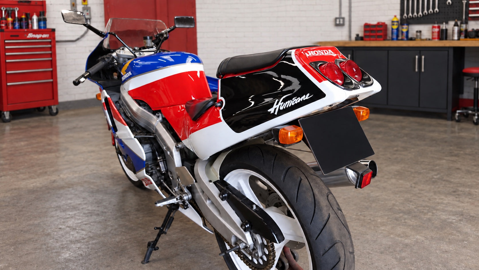 Honda Hurricane motorcycle with a red, white, blue and black paint scheme completed by the team